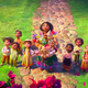 Encanto's animated Mirabel and a number of children on a stone walkway look up in wonder at the Madrigals' house, which is bathed in flowers.